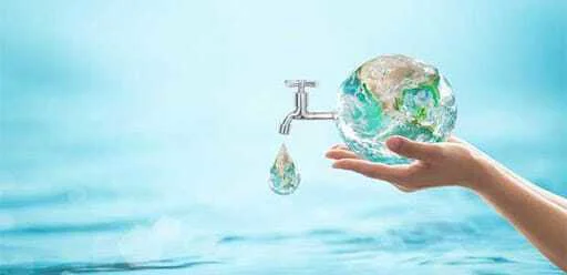 Hand holding glass earth with water tap dripping