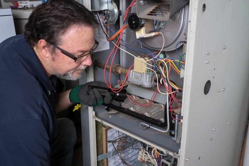 Working on a furnace in SLC.